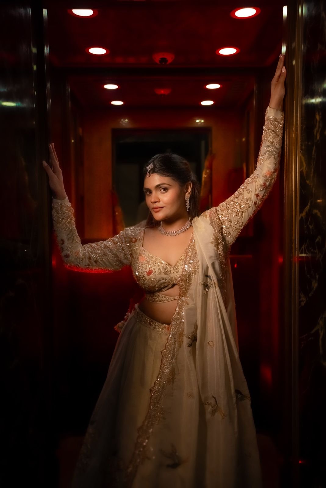 Anchal Bhatt in an ivory and gold lehenga